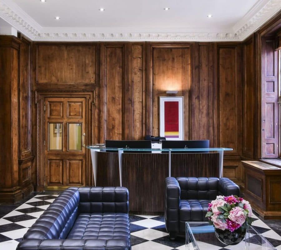 Reception area with fireplace at the Davies Street luxury serviced office property in Mayfair