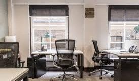 A private office with a large window in the Birchin Lane high-end flexible offices in London