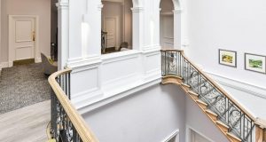 A shot showing the landing and staircase with original features at the Mayfair Office Space on Curzon Street