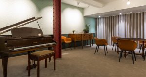 A chill out space with piano at The Bloomsbury Building