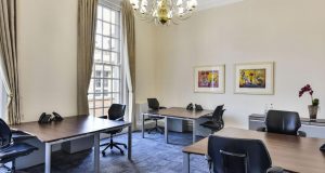 A private office with chandelier and sash windows at the premium office space property in Covent Garden