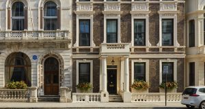 The front elevation of the office space on Pall Mall complete with white stucco , window boxes and other distinct features