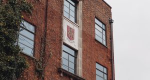 The crest on the wall of 81 Rivington Street highlighting that the office building was once a local power station