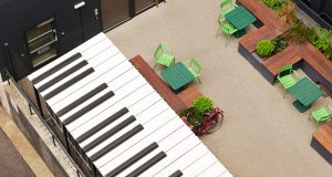 The outdoor terrace with a musical theme at Henry Wood House