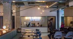 Meeting rooms for hire with coworking desks in the foreground at Albert House in London