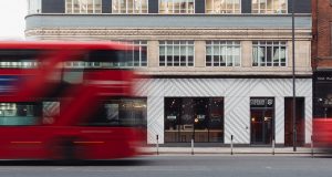 A London bus passing by the stylish office space on Whitechapel High Street