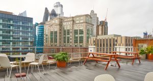 The roof terrace at 133 Whitechapel High Street providing views of iconic buildings in the City of London